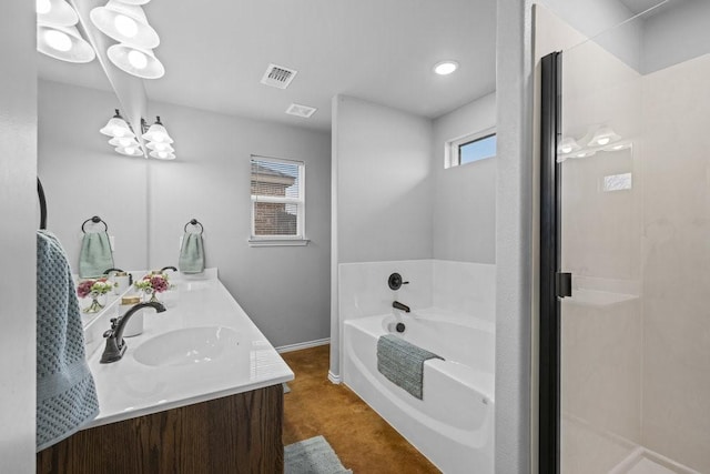 bathroom with a tub and vanity