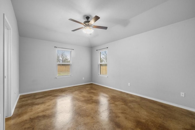 spare room with ceiling fan and lofted ceiling