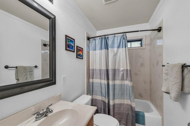 full bathroom featuring shower / bath combo with shower curtain, vanity, toilet, and ornamental molding