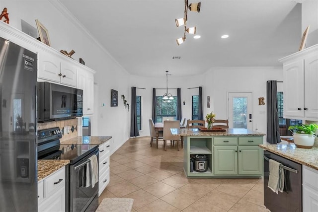 kitchen featuring dishwashing machine, black electric range oven, white cabinets, green cabinets, and stainless steel refrigerator