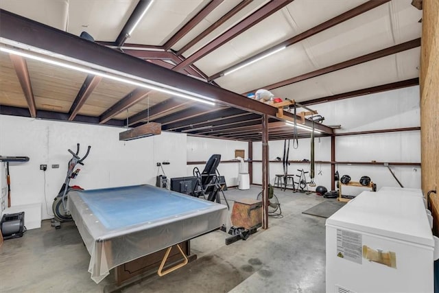 basement with pool table and fridge