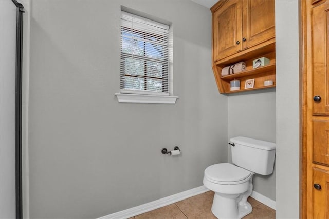 bathroom with tile patterned floors and toilet