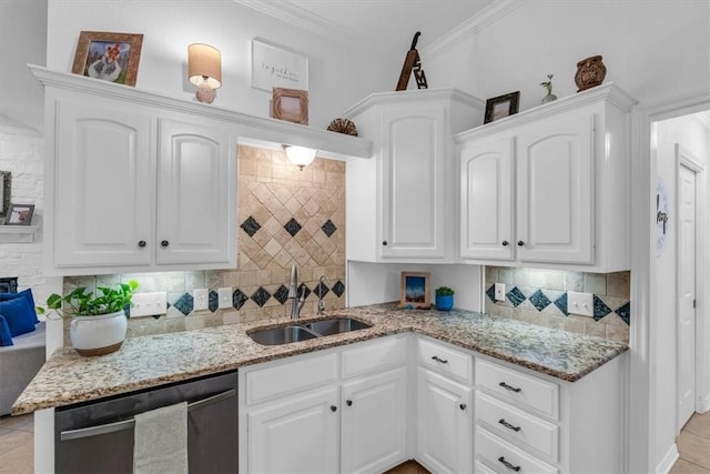 kitchen featuring sink, dishwasher, and white cabinetry