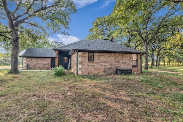 back of property featuring a lawn