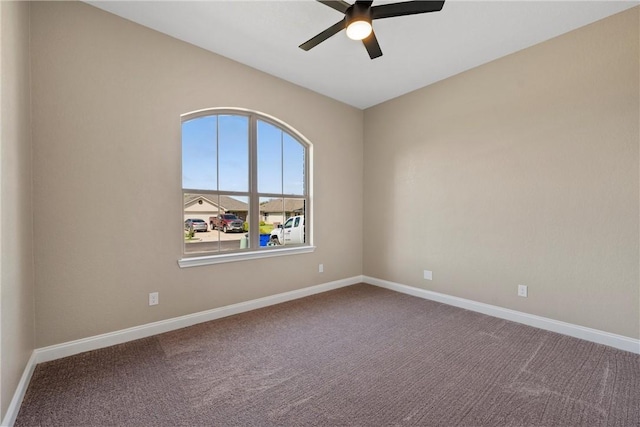 carpeted empty room with ceiling fan