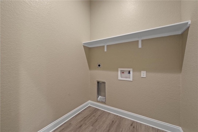 clothes washing area with hookup for an electric dryer, wood-type flooring, and hookup for a washing machine