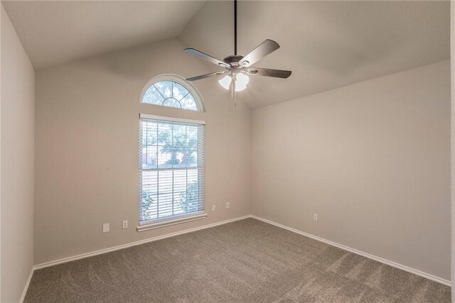 spare room featuring carpet flooring, ceiling fan, and lofted ceiling