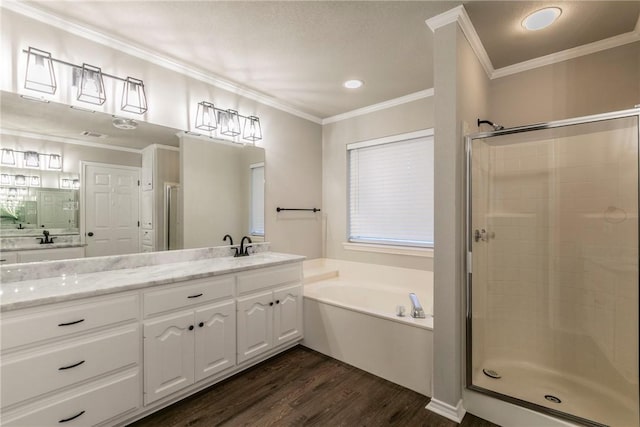 bathroom featuring wood-type flooring, vanity, independent shower and bath, and crown molding