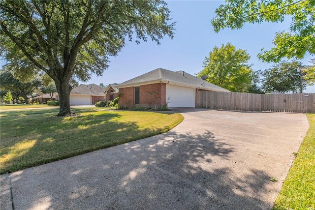 view of front facade with a garage and a front lawn