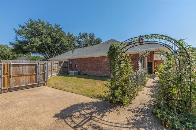 exterior space with a yard and cooling unit