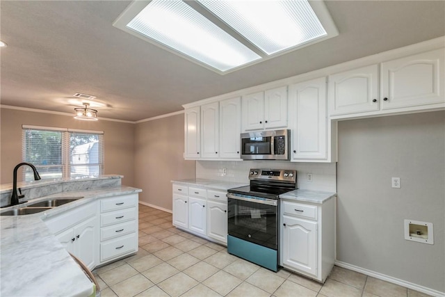 kitchen featuring tasteful backsplash, stainless steel appliances, crown molding, sink, and white cabinets