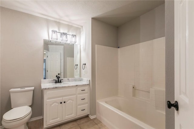 full bathroom with vanity, tile patterned floors, washtub / shower combination, toilet, and a textured ceiling