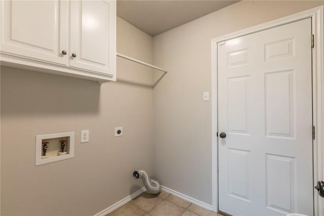 laundry area with washer hookup, electric dryer hookup, cabinets, and light tile patterned floors