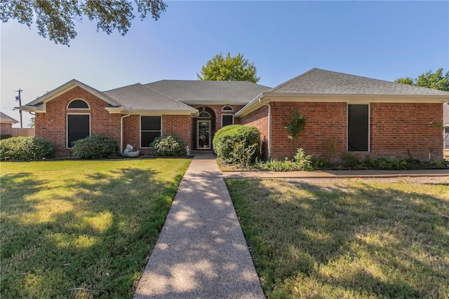 single story home with a front lawn