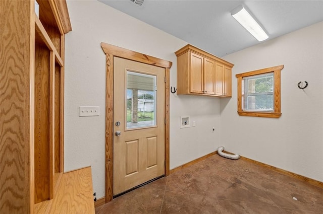 clothes washing area with electric dryer hookup, cabinets, washer hookup, and hookup for a gas dryer