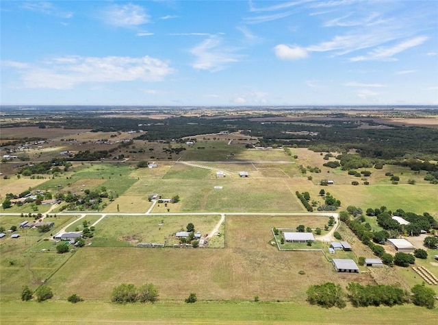 birds eye view of property with a rural view