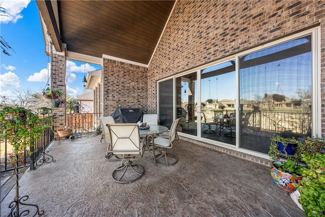 view of patio / terrace with outdoor dining space and a grill