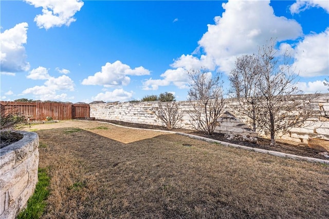 view of yard featuring a fenced backyard