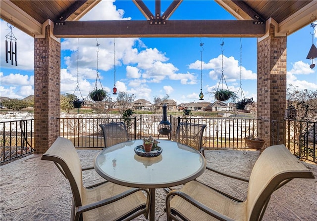 view of patio / terrace featuring outdoor dining space and a balcony