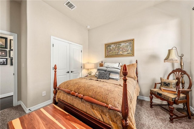 bedroom featuring visible vents, baseboards, carpet, and a closet