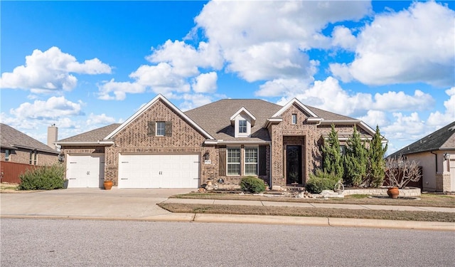 view of front of property featuring an attached garage, brick siding, driveway, and a shingled roof