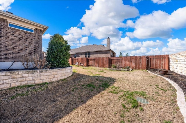 view of yard featuring a fenced backyard