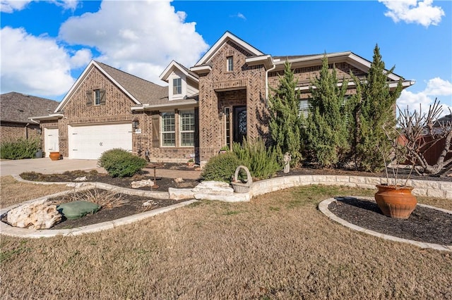 view of front of house with brick siding and driveway