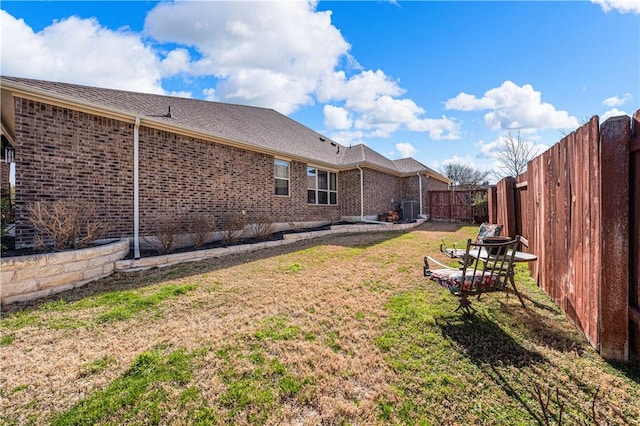 view of yard featuring cooling unit and a fenced backyard