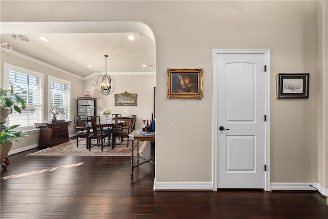 dining area with recessed lighting, an inviting chandelier, crown molding, baseboards, and dark wood-style flooring