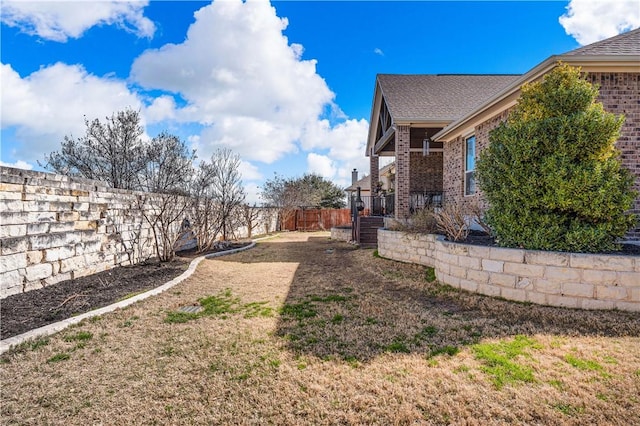 view of yard with a fenced backyard