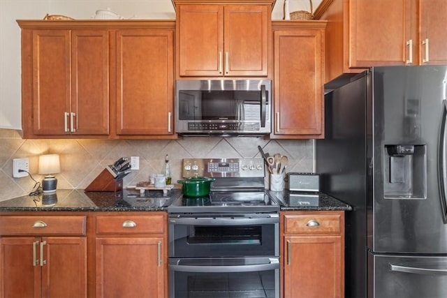 kitchen featuring appliances with stainless steel finishes, brown cabinetry, and backsplash