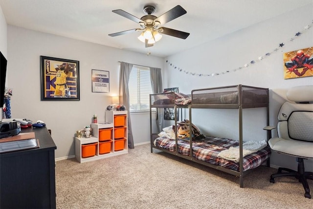 bedroom with ceiling fan, baseboards, and carpet flooring