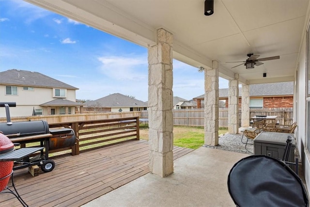 view of patio / terrace with a residential view, a fenced backyard, and a ceiling fan