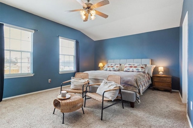 bedroom featuring a ceiling fan, carpet flooring, vaulted ceiling, and baseboards