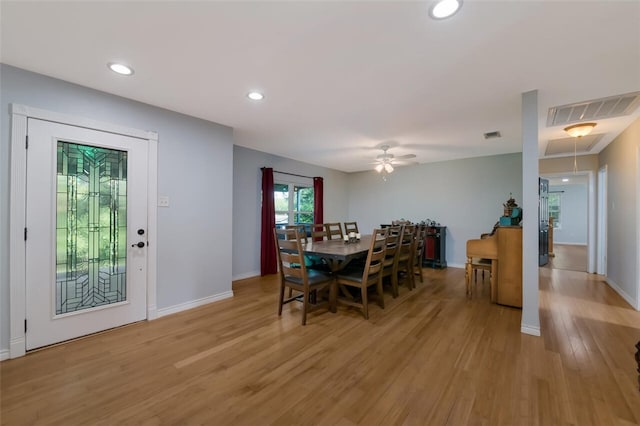 dining area featuring ceiling fan and light hardwood / wood-style flooring