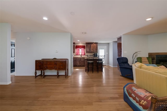 living room with light hardwood / wood-style floors