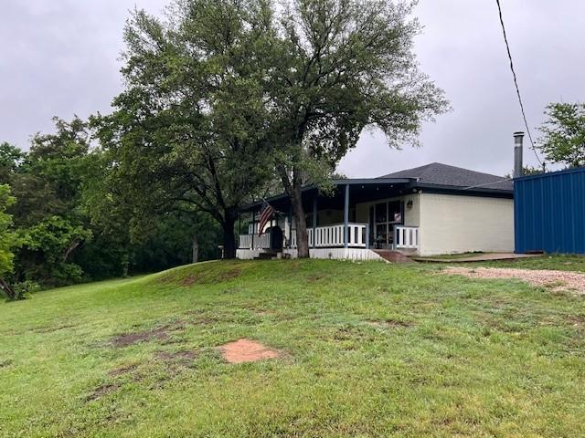 view of yard featuring covered porch