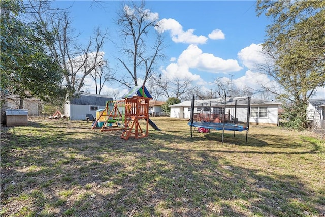 view of jungle gym with a shed, a trampoline, an outdoor structure, and a lawn