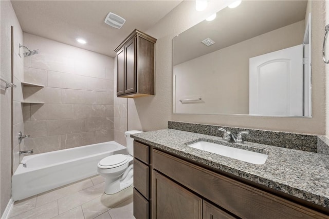 full bath featuring tile patterned flooring, visible vents, tub / shower combination, toilet, and vanity