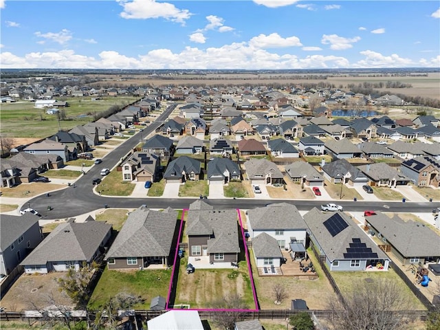 birds eye view of property with a residential view