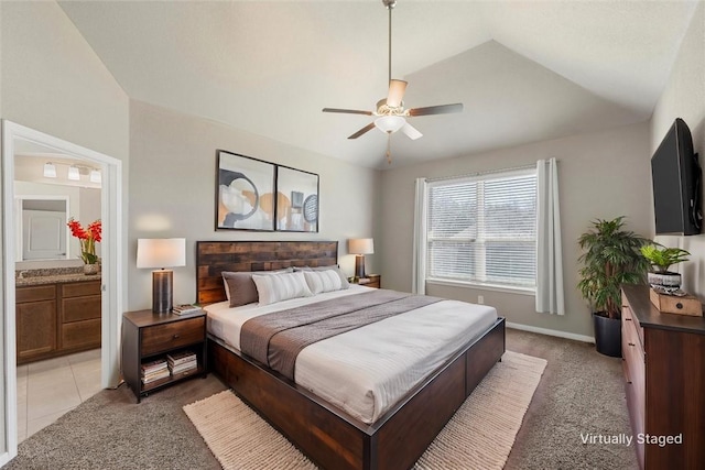 bedroom with lofted ceiling, light colored carpet, baseboards, and ceiling fan