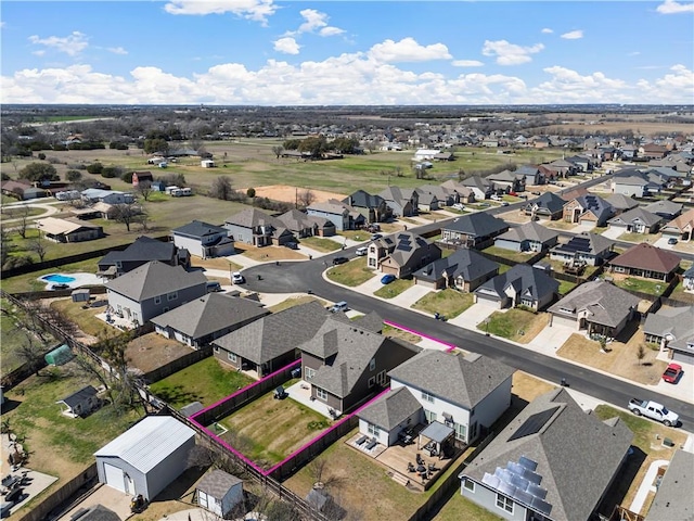 birds eye view of property with a residential view