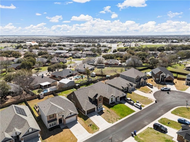 birds eye view of property with a residential view