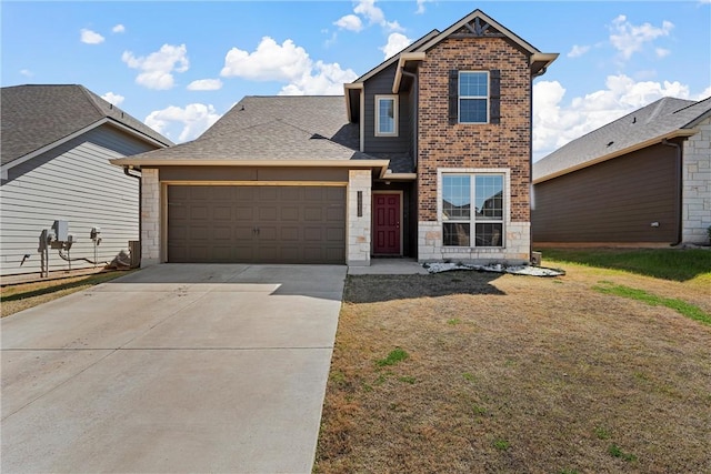 traditional home with a front lawn, driveway, stone siding, a shingled roof, and a garage