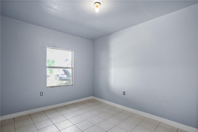 spare room with light tile patterned floors