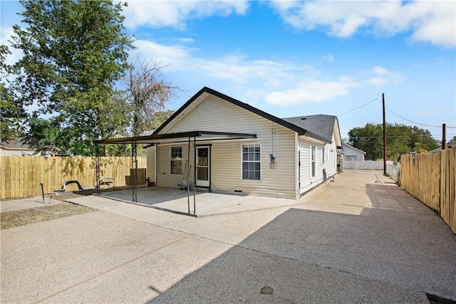 back of property featuring a patio area