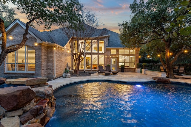 outdoor pool with a patio