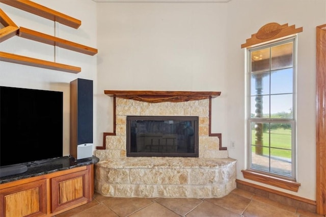 tiled living room with a fireplace