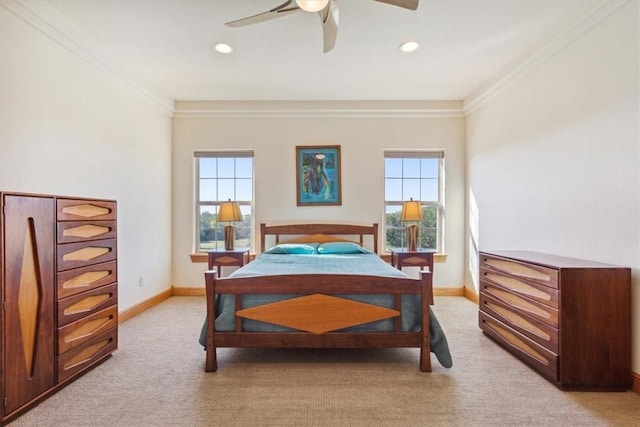 carpeted bedroom featuring multiple windows, ceiling fan, and crown molding