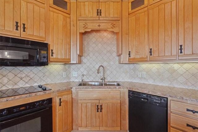 kitchen with tasteful backsplash, light stone counters, sink, and black appliances